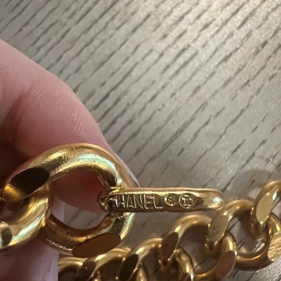90’s. Vintage CHANEL thick chain belt with golden mademoiselle and CC charm.